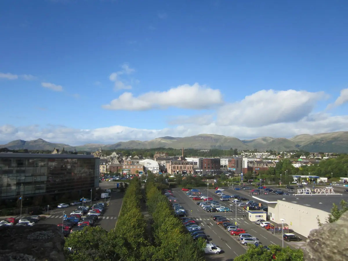 Tree-lined avenue and car park leading towards Alloa Tower in the town